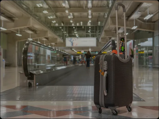 Traveler with luggage inside the Miami International Airport terminal